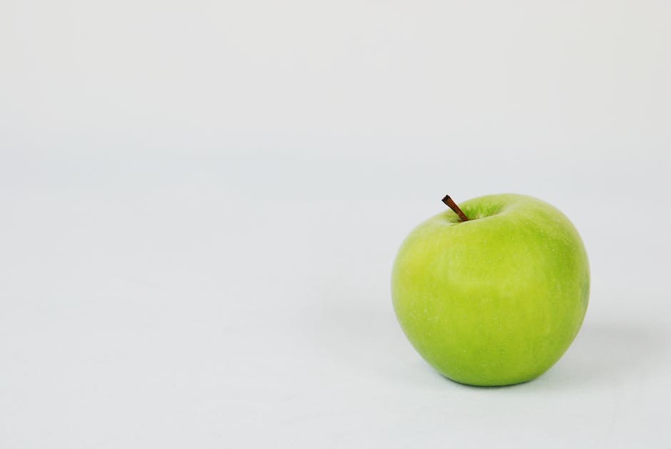 Scientific illustration of apple classification, highlighting its botanical taxonomy and the distinction between fruits and vegetables.