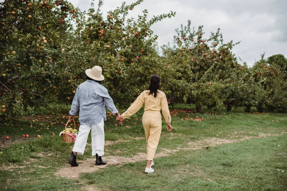 A family standing in an apple orchard, holding baskets of freshly picked apples