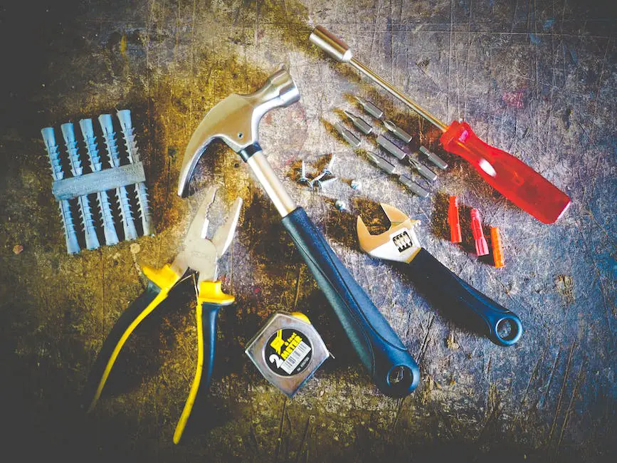 Image of a person grafting an apple tree branch onto the rootstock with different tools