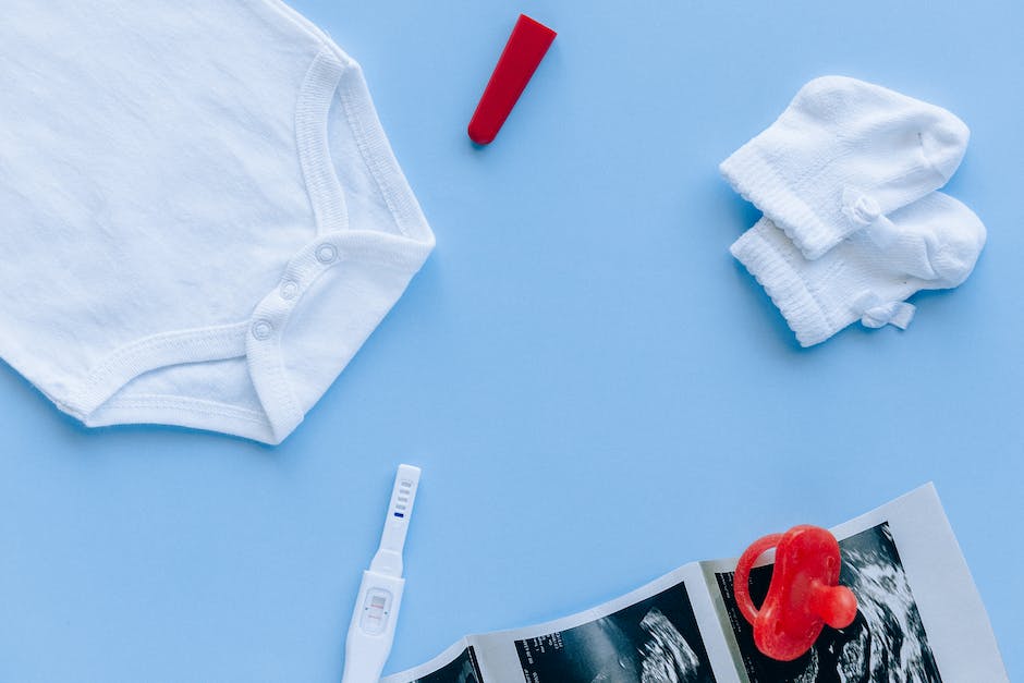 A picture of a home pregnancy test with a positive result showing a plus sign.