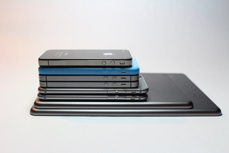 A lineup of iPhones from different generations, showcasing the evolution of Apple's iconic smartphone